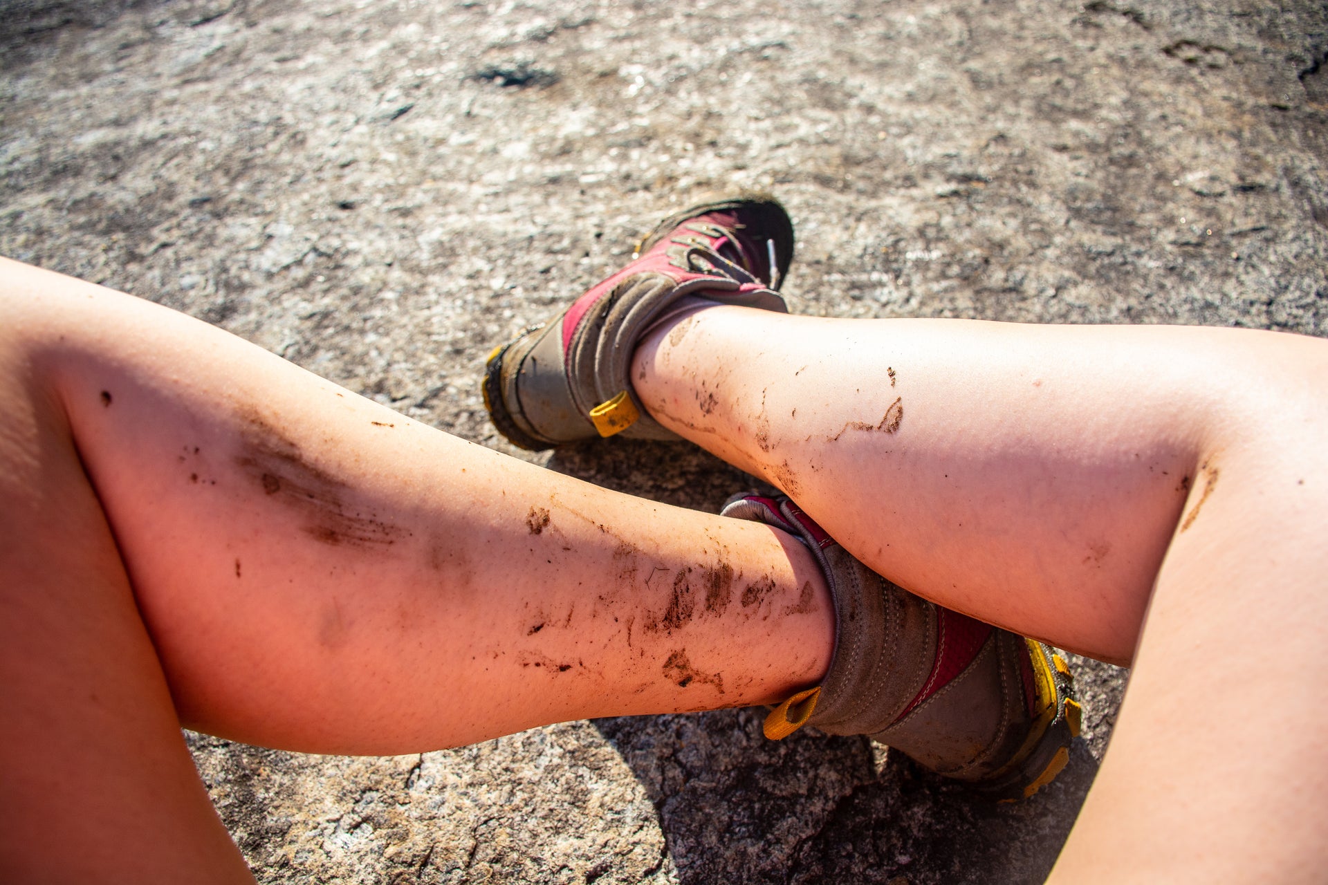 mud spattered woman hiker s legs